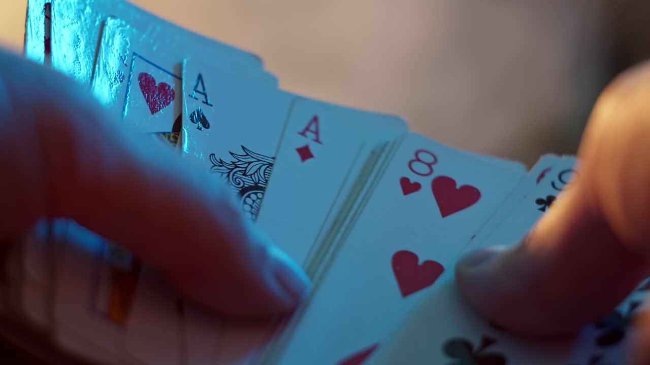 Close-up of hands shuffling playing cards