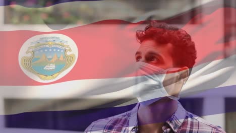 Animation-Der-Flagge-Von-Costa-Rica,-Die-Während-Der-Covid-19-Pandemie-über-Einem-Mann-Mit-Gesichtsmaske-Winkt