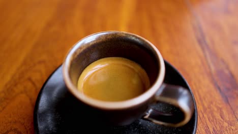 espresso cup on table, viewed from above