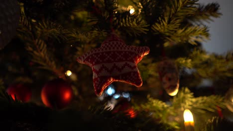 knitted red star on a christmas tree