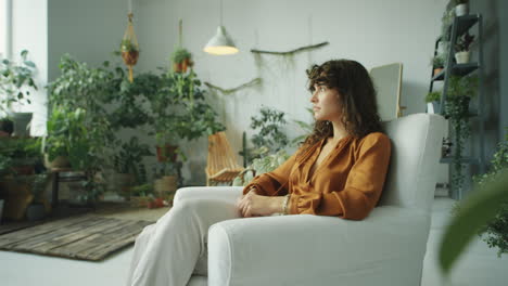 beautiful woman in room with houseplants