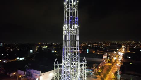 a stunning drone video showcasing the majestic tower of the reformador in guatemala, shot from bottom to top, offering a unique perspective of the architectural masterpiece and the cityscape