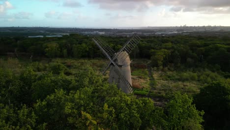 bidston windmill at dawn, aerial drone clockwise pan sun kissed and beautiful