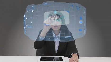 Businesswoman-using-futuristic-touchscreen