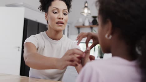 Happy-african-american-mother-and-daughter-using-sign-language,-slow-motion