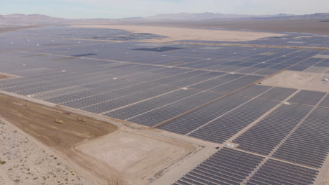 huge solar power farm in a desert, aerial panorama