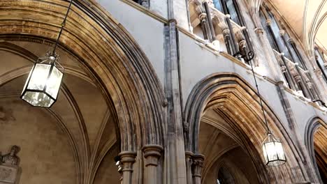 medieval christ church arches illuminated by hanging lights in dublin