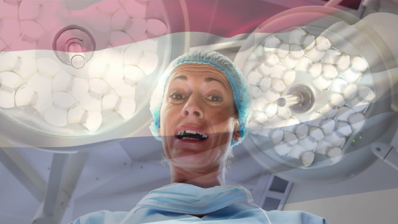 animación de la bandera de los países bajos ondeando sobre el cirujano en la sala de operaciones