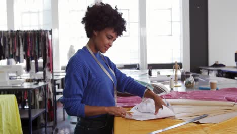 Mixed-race-woman-working-in-creative-office