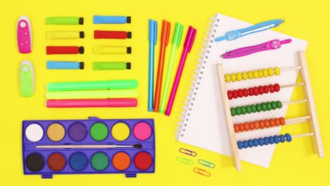 school accessories appear on yellow theme. back to school stop motion