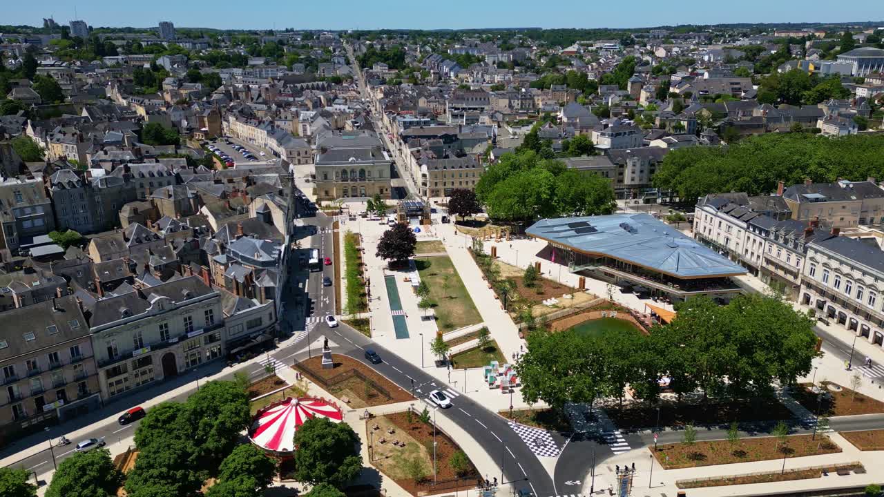 Place du 11 Novembre in Laval, France, modern Halles St Louis building, urban park, cityscape, Establishing shot of urban redevelopment. Aerial drone sideways