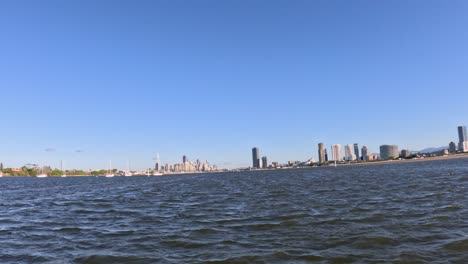 city skyline viewed from a moving boat