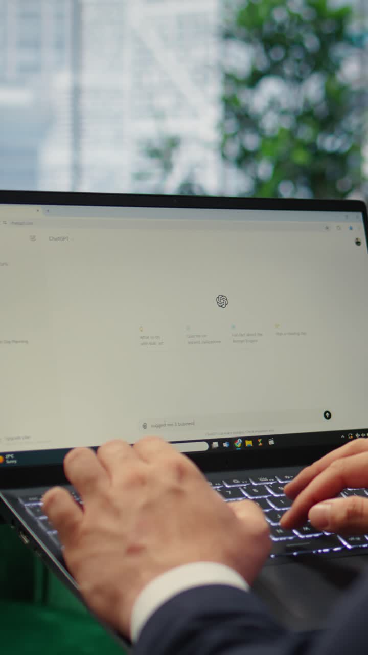 Vertical Video Bucharest, Romania - July 30th 2024 - Person typing into an AI chatbot system