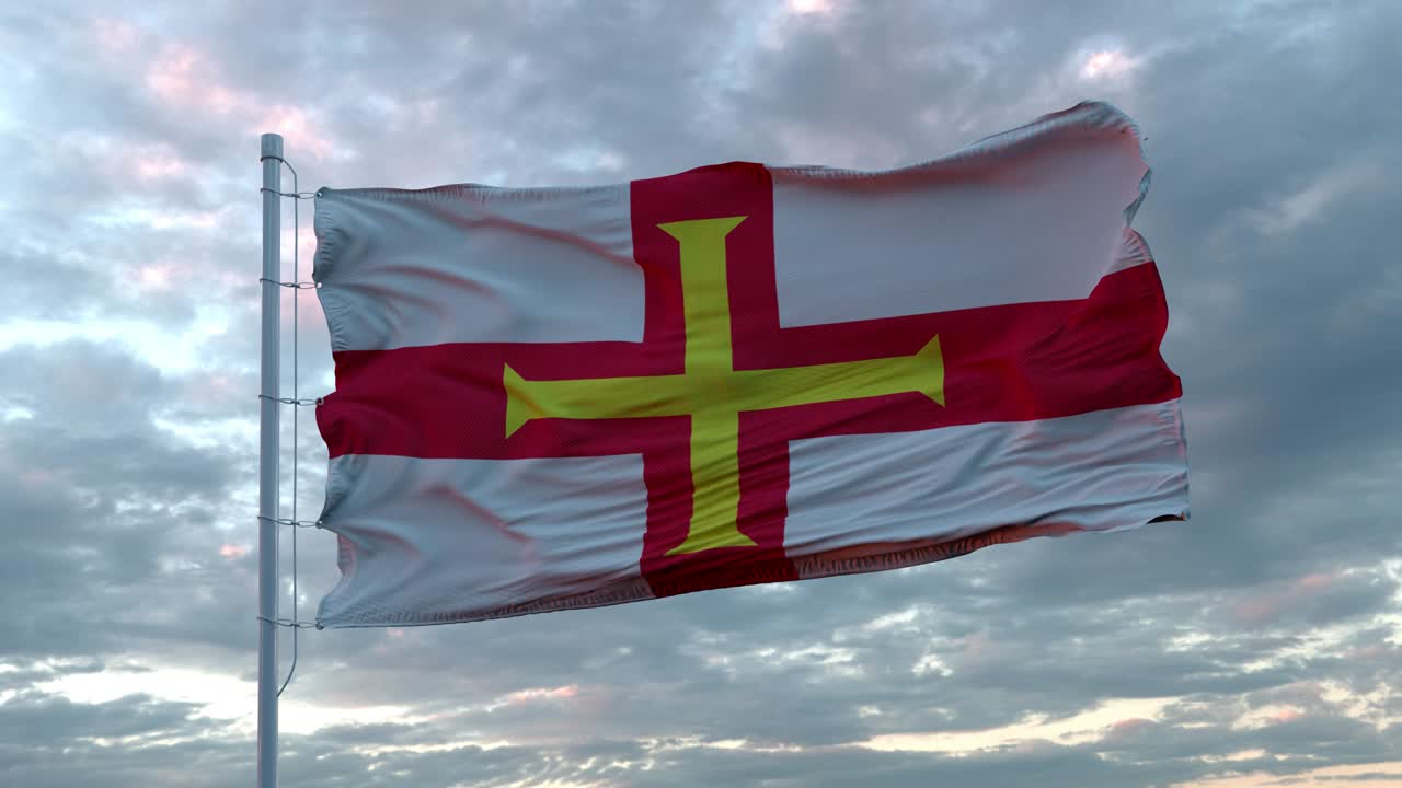 Realistic flag of Guernsey waving in the wind against deep Dramatic Sky. 4K UHD 60 FPS Slow-Motion