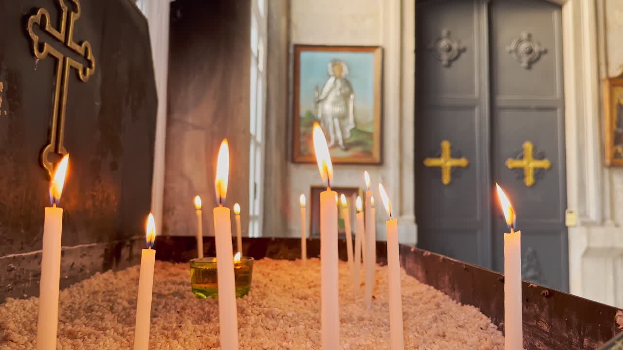 prayer, candle, cross in historical church