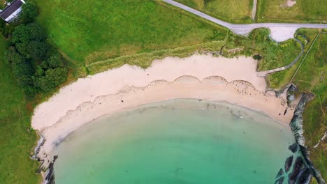 Aerial-view-going-upward-in-4K-of-Silver-Strand-in-Sherkin-Island,-South-West-Cork,-Ireland