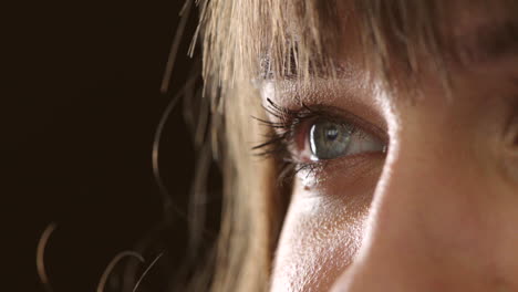 closeup of human blue eye expressing excitement