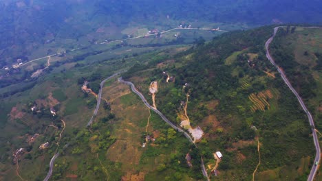 aerial ascending shot over the misty mountains of northern vietnam