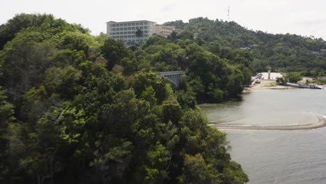 aerial - bridge and luxury hotel in samana, dominican republic, forward wide shot