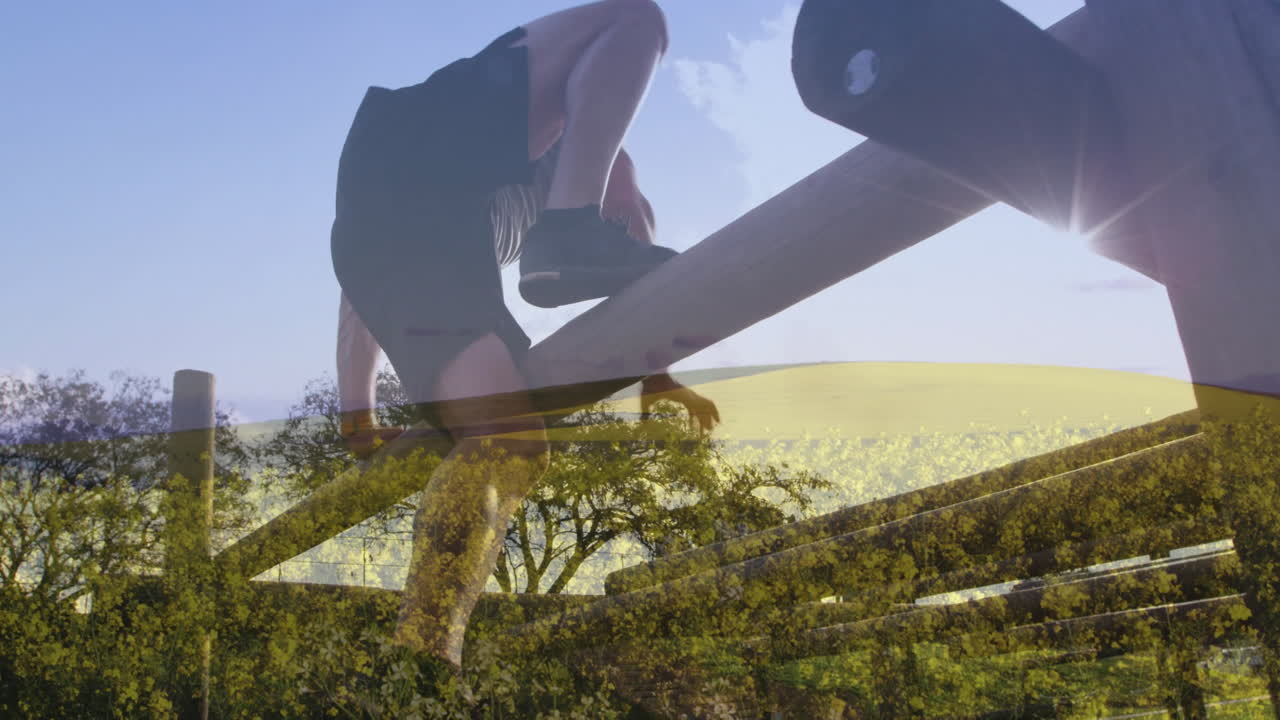 Climbing wooden obstacle, person over scenic landscape with trees and fields