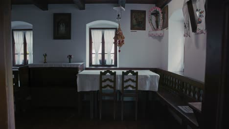 traditional croatian dining room with simple wooden furniture in kumrovec, croatia