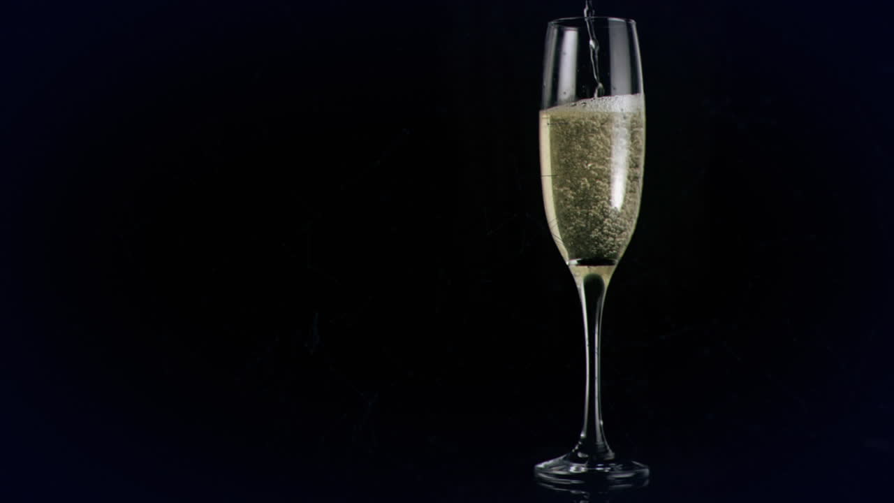 Animation of champagne glass with green network on black background