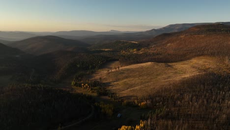 aerial view of a burnt mountain valley at sunset