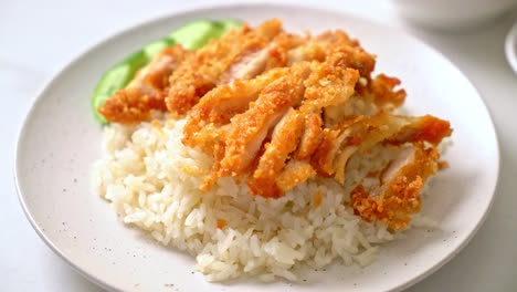 Hainanese-chicken-rice-with-fried-chicken-or-rice-steamed-chicken-soup-with-fried-chicken---Asian-food-style