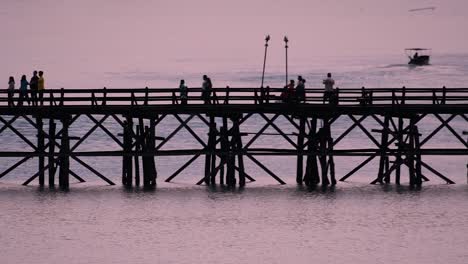 the mon bridge is an old wooden bridge located in sangkla, thailand