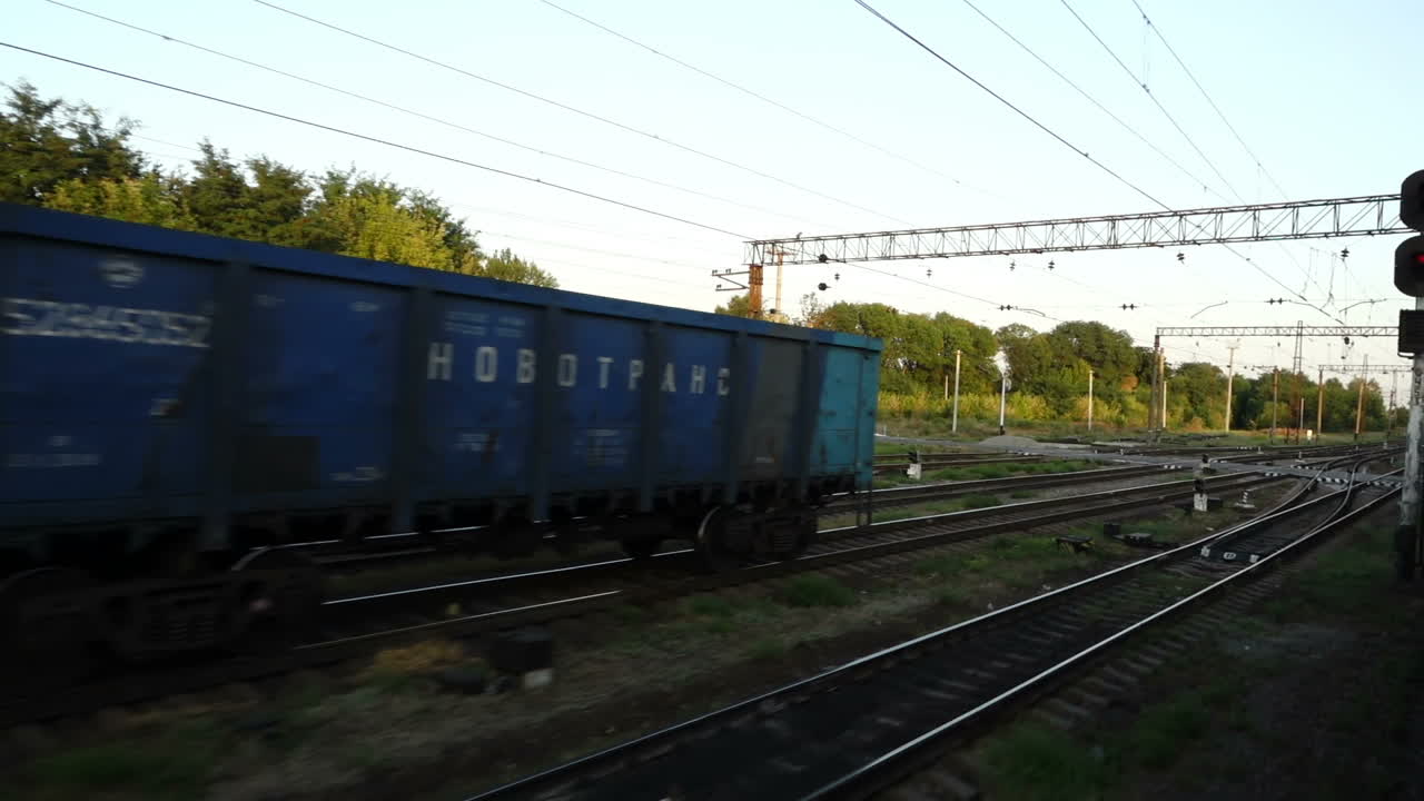 Cargo carriage of the railway train. Shooting in the movement