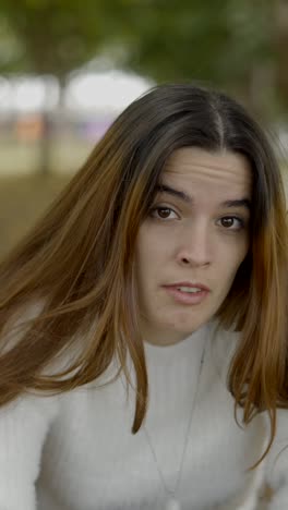 a young woman's changing expressions in an outdoor setting