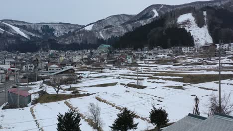 snow melting in nozawa onsen ski resort of nagano japan during winter, aerial