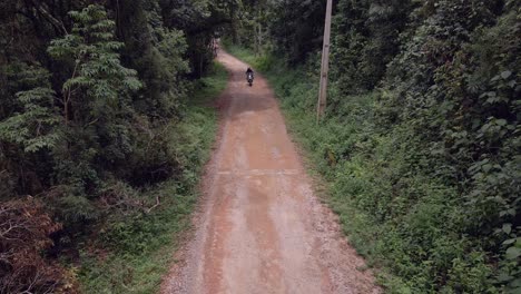 bmw 650x lightweight adventure motorcycle in low rainforest in brazil, extrema - minas gerais