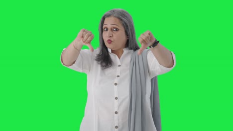 Disappointed-Indian-senior-businesswoman-showing-thumbs-down-Green-screen