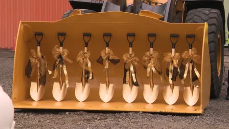 golden shovels at a breaking ground ceremony