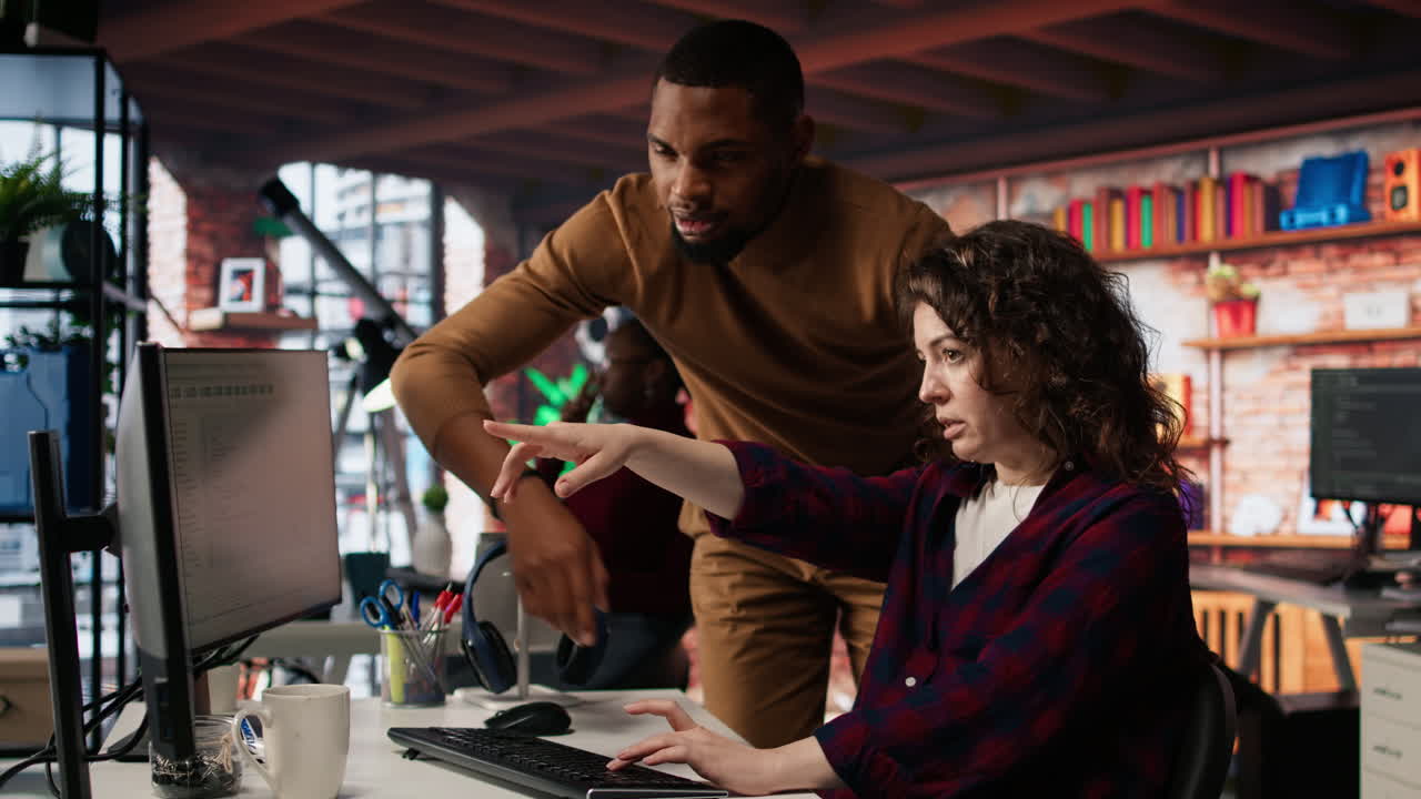 Startup office chief technology officer overseeing woman building application