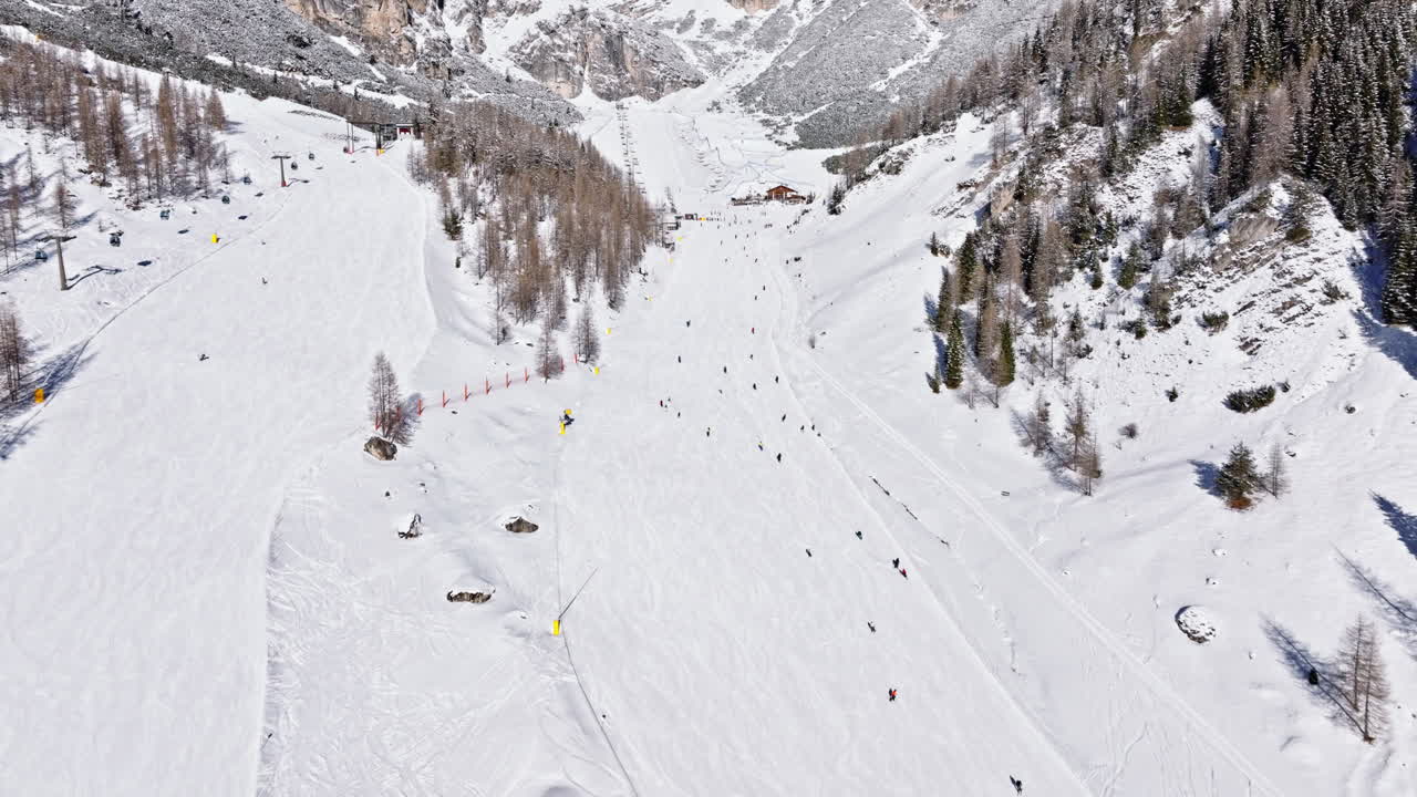 Aerial drone view of the Colfosco ski resort in South Tyrol, Dolomites, Northern Italy