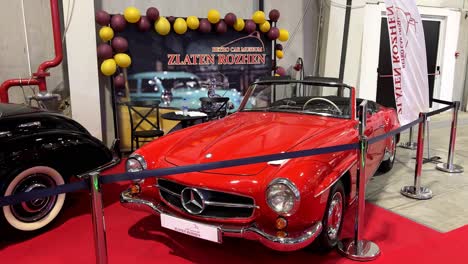 mercedes 190 sl at the sofia motor show 2024. it's a vintage sports car for all seasons. classic car.