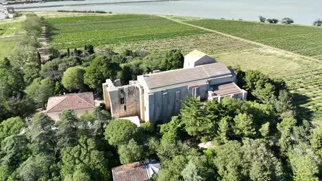 The-Maguelone-cathedral-from-the12th-century-Roman-architecture-in-a-volcanic-island-near-the-Mediterranean-coast-of-France,-Aerial-orbit-around-shot