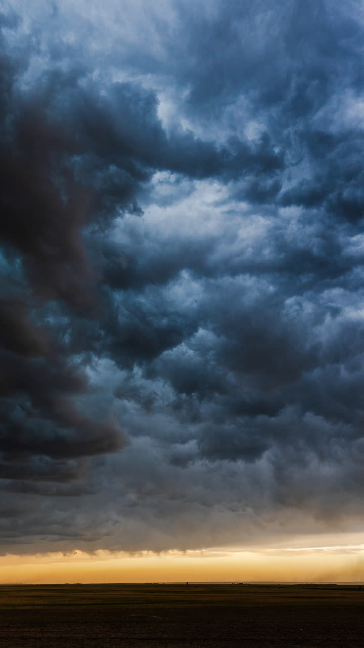 Moody sky filled with shifting storm clouds creating deep layered cloud movement