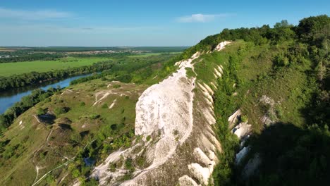 aerial view of a white cliff and valley landscape