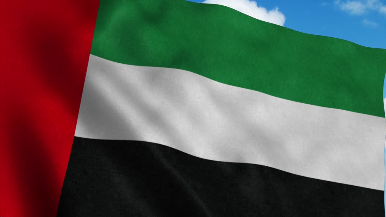 la bandera de los emiratos árabes unidos ondeando en el viento, fondo de cielo azul. 4k