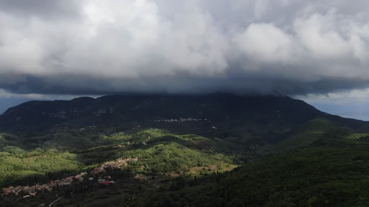 Drone flying in the mountains with clouds