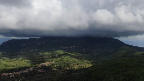 drone flying in the mountains with clouds