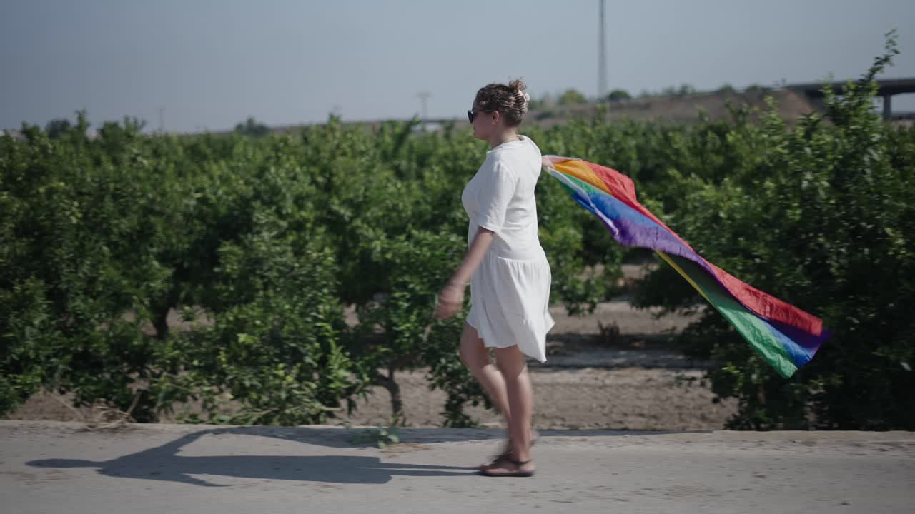 Woman Walking with Rainbow Pride Flag
