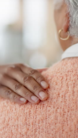 a comforting hand resting on the shoulder of an elderly woman