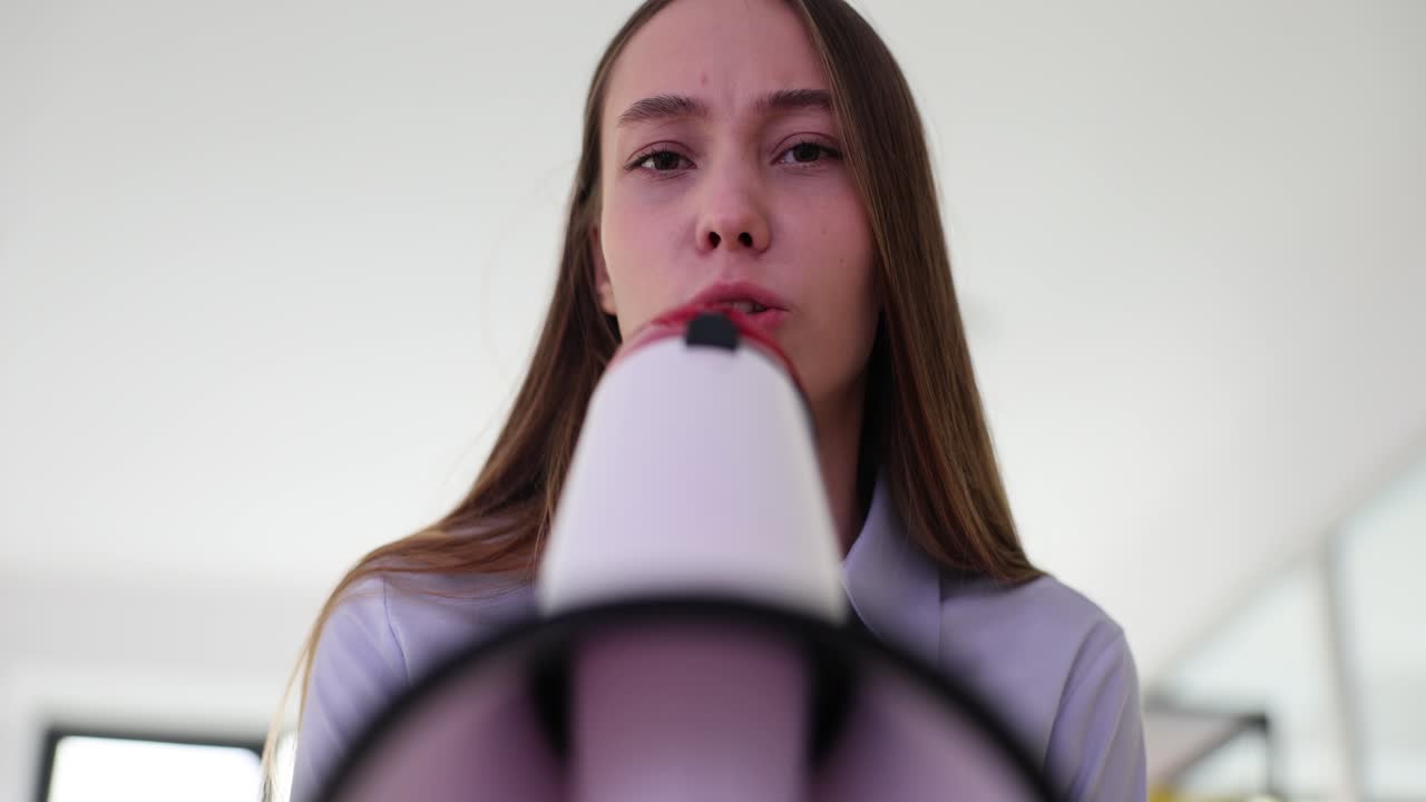 Woman with megaphone making announcement