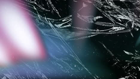 animation of light streaks and shattered glass pattern on dark background