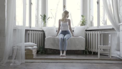 woman relaxing by a window