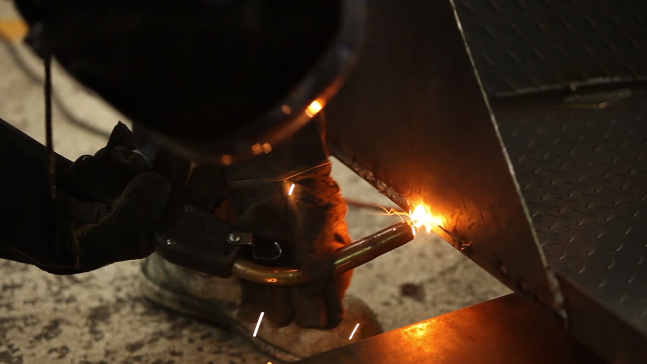 Hot welding arc used to connect metal sheets together to create customized product for customer